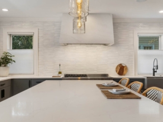 The quartz range hood was a custom design fabricated from the same material as the countertop.